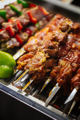 Selective focus on prepared raw skewers shashlyq