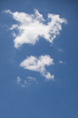 Puffy  white clouds against a blue sky