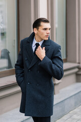 Man in a stylish suit. Businessman in an autumn city, fashion