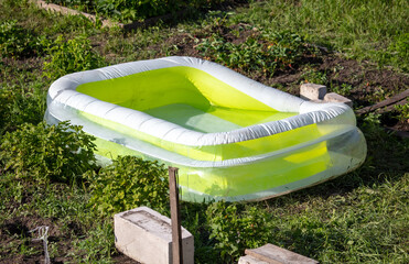Inflatable green pool in nature