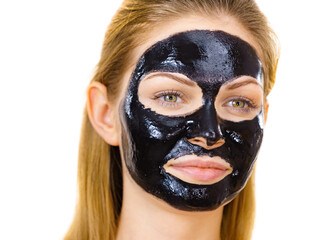 Girl black carbo peel off mask on face
