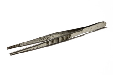 Rusty and old forceps on white background.