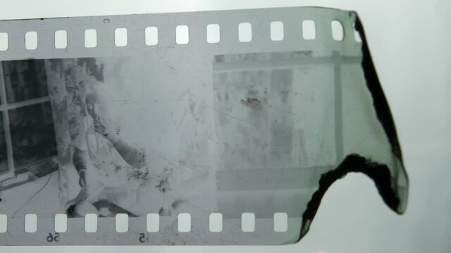 Burning Negative Plastic Film Strip with a Lighter