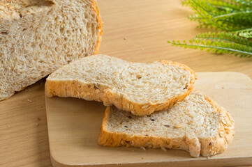 Whole wheat breads on cutting board.