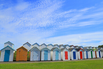 Beach huts near Broadsands Beach in Devon, UK