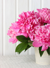 bouquet of pink peonies on the table.