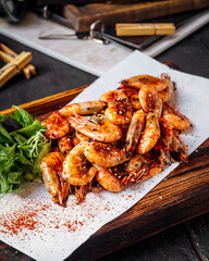 Closeup on roasted shrimps prawns appetizer