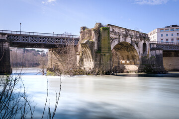 Emilio bridge or Ponte Rotto, ancient Roman bridge over the Tiber river, near the Isola Tiberina island in Rome, Italy