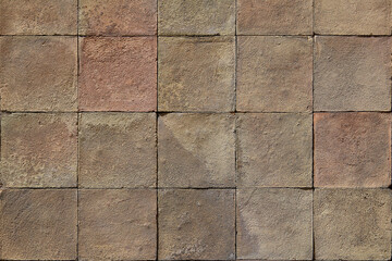 Auburn quadratic stone tiles on wall -texture background