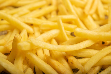 French fries scattered surface texture. Close up.
