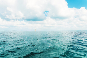 Sailboat in ocean in Zanzibar at cloudy day