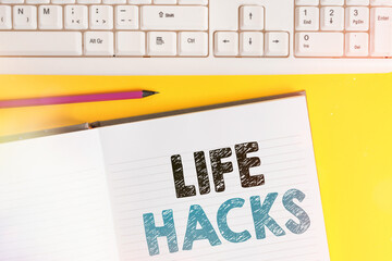 Word writing text Life Hacks. Business photo showcasing strategy or technique adopted to manage activities efficiently Copy space on notebook above yellow background with keyboard on table