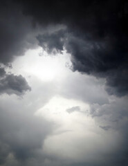 Dark thunderclouds on a gray sky. Weather forecast. Thunderstorm and storm.