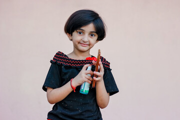 indian little girl sanitizing phone