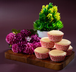 Ancient egg cakes in paper cup with purple background
