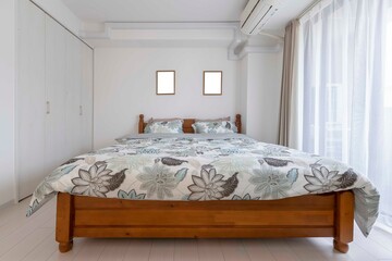 King size bed in modern small bedroom at apartment