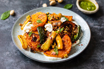 Roast butternut squash and courgettes with feta and yougurt sauce