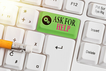 Writing note showing Ask For Help. Business concept for put a question or seek an answer or...