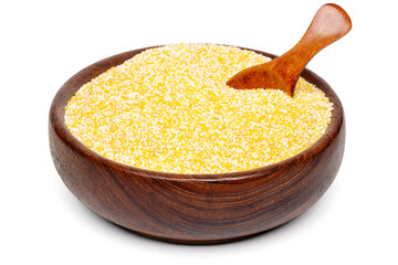 Natural organic corn grits in a wooden bowl and spoon