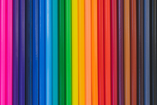 A palette of colored pencils. Multi-colored stationery. Goods for school and kindergarten. Pencils for drawing. Concept.