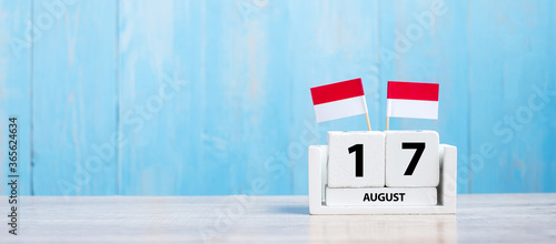 Wooden calendar of August 17th with miniature Indonesia flags. Indonesia’s independence day, Nation holiday Day and happy celebration concepts