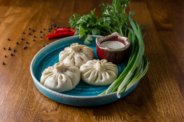 Homemade dumplings with pepper and herbs