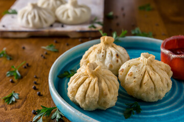 Homemade dumplings with pepper and herbs