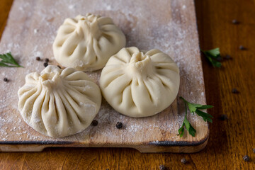 Homemade dumplings with pepper and herbs
