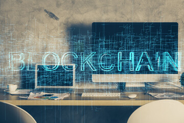 Multi exposure of blockchain theme hologram and table with computer background. Concept of bitcoin crypto currency.