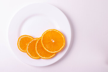 sliced citruses on white 
