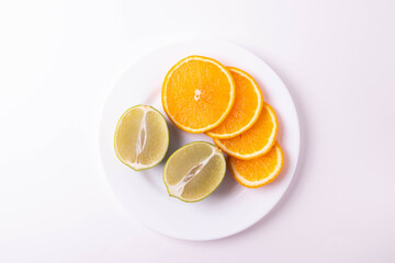 sliced citruses on white 