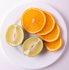 sliced citruses on white 
