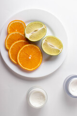 sliced citruses on white 