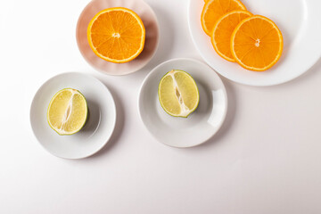 sliced citruses on white 
