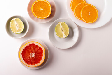 Fototapeta na wymiar sliced citruses on white 