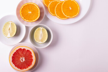 sliced citruses on white 