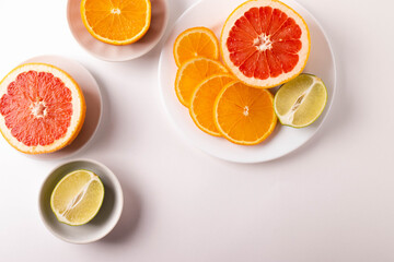 sliced citruses on white 