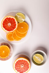 sliced citruses on white 