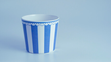 Blue and white popcorn container isolated on white background 