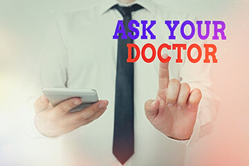 Conceptual hand writing showing Ask Your Doctor. Concept meaning seeking information or advice from a medical professional Model pointing finger symbolizing navigation progress growth
