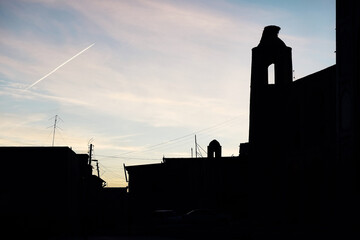 Beautiful pink sunrise in the morning with airplane near the old city