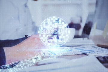 Man's hands working with notes background. Cryptocurrency and finance concept.