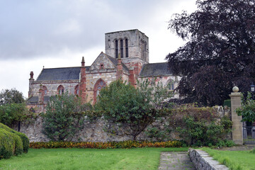 Old Walled Garden with Ancient Stone Church in Background