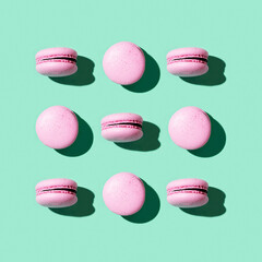 Fototapeta premium Regular creative pattern of colorful french cookies macarons.
