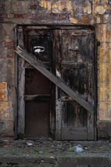 Fototapeta na wymiar Wooden vintage door. Ancient entrance concept background. Grunge aged and textured doorway backdrop.