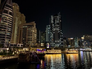 Fototapeta na wymiar Dubai skyline at night as viewed from the creek