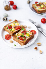 Ham and fried egg open sandwich, ham and fried egg on a gray concrete table. Сlose-up, top view.