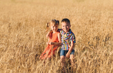 boy hugging girl in wheat