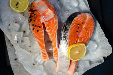 red fish steak on ice with herbs and spices