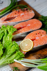 red fish steak with herbs, spices and lemon